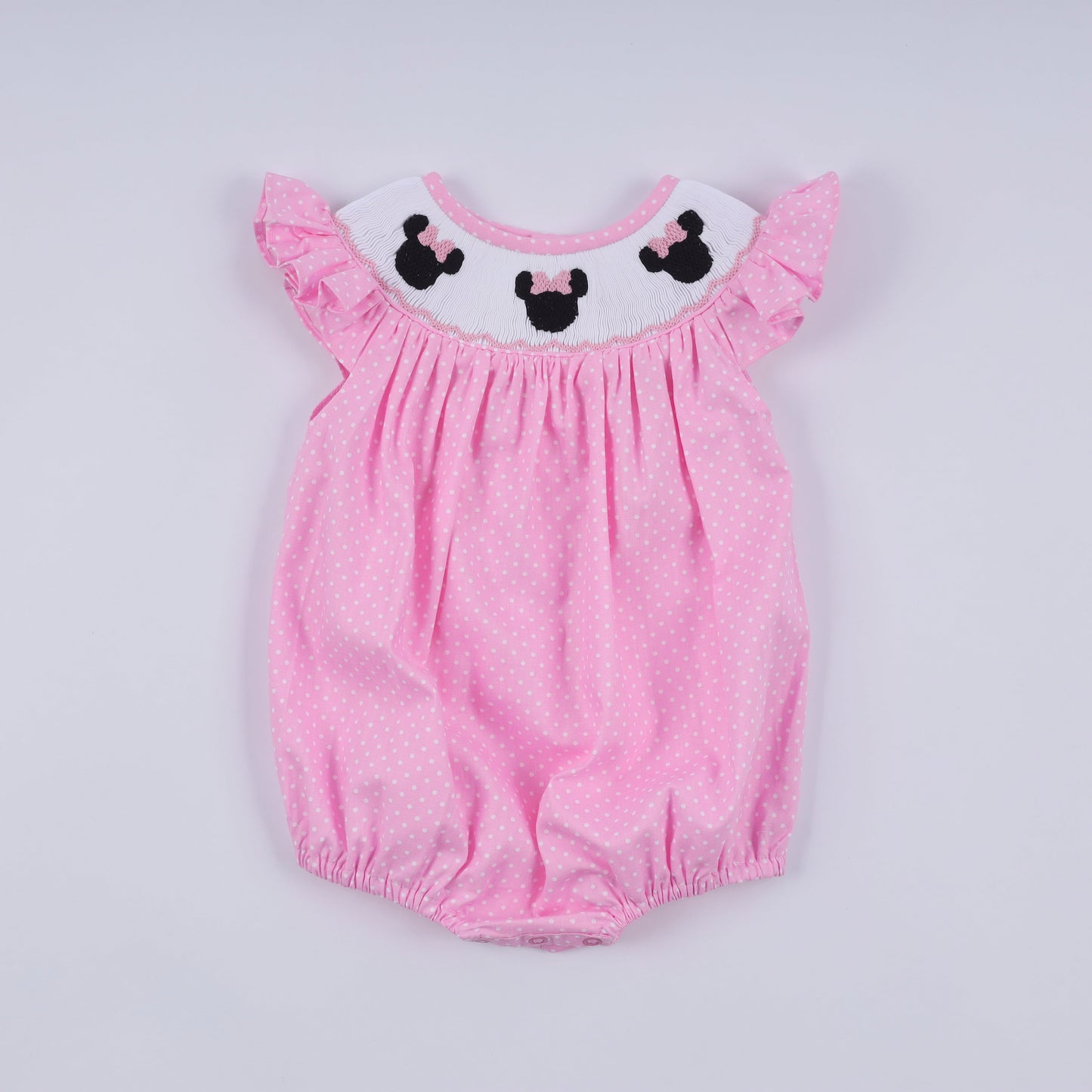 Pink character hand smocked dot ruffle bubble